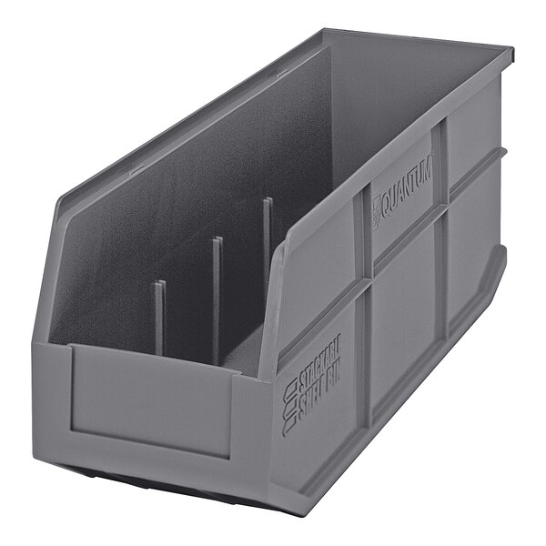 A Quantum gray plastic stackable shelf bin with two compartments.