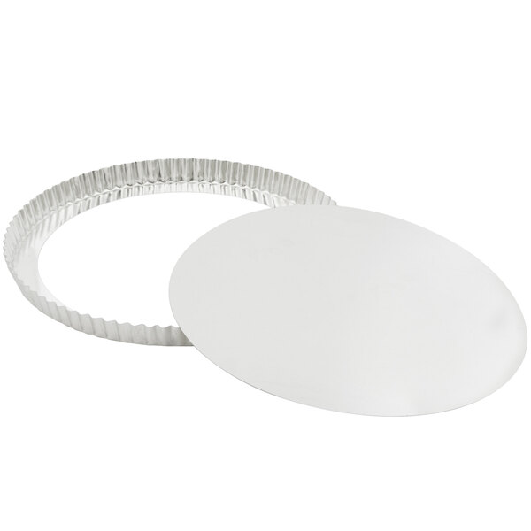 A Gobel round fluted tart and quiche pan with a removable bottom.