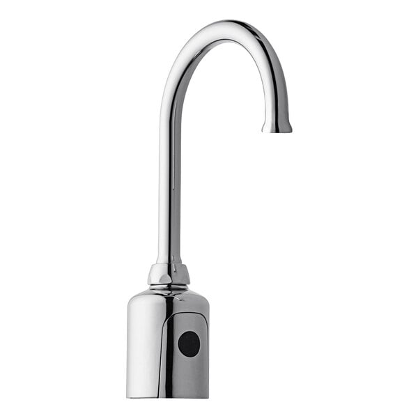 A silver Chicago Faucets touchless faucet with a black button.