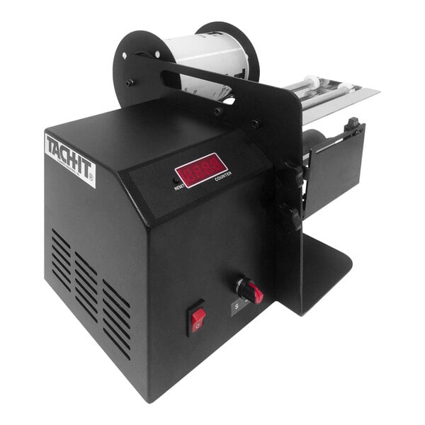 A black Tach-It KL-150 label dispenser with a white label on it.