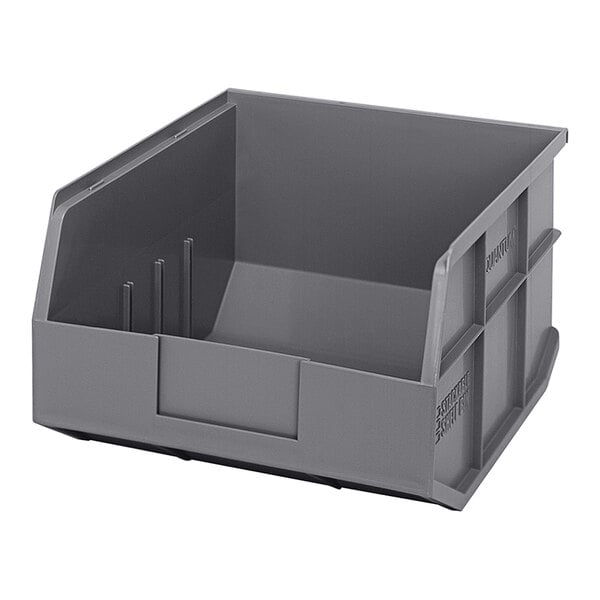 A gray plastic Quantum stackable shelf bin.