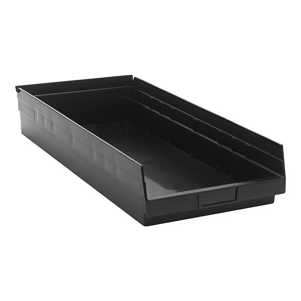 A black plastic Quantum shelf bin with two compartments.