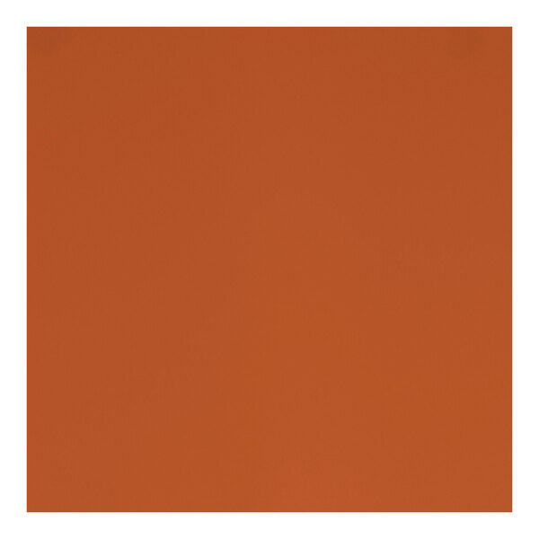 A close-up of a red microtexture table top with a square design.