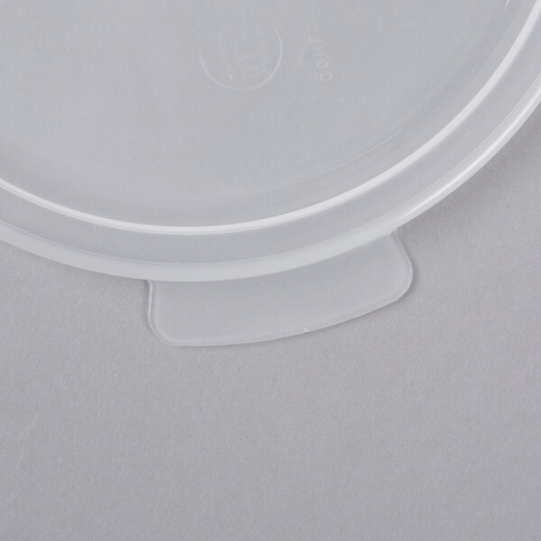 A clear plastic Cambro food storage container lid on a surface.