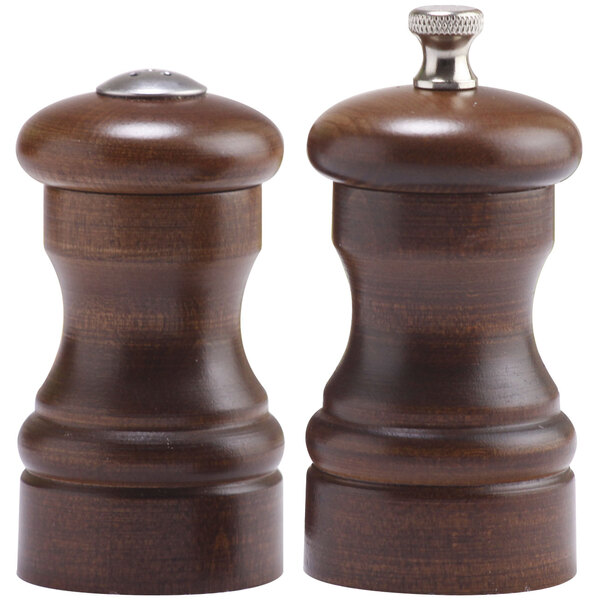 Two wooden Chef Specialties Capstan pepper mills with metal handles.