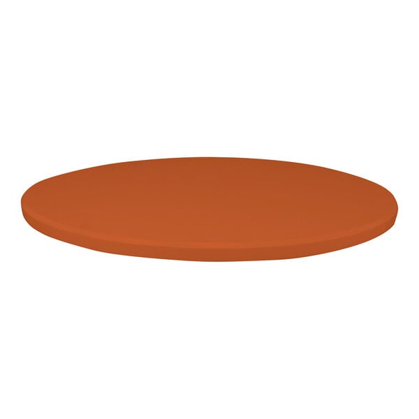 A close-up of a round brown table top with a textured surface in orange.