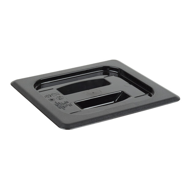 A black plastic square container lid with a handle.