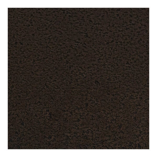 A close-up of a hammertone copper table top with a black surface.