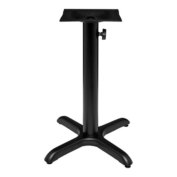 A black metal standard height column base for an outdoor table with an umbrella hole.