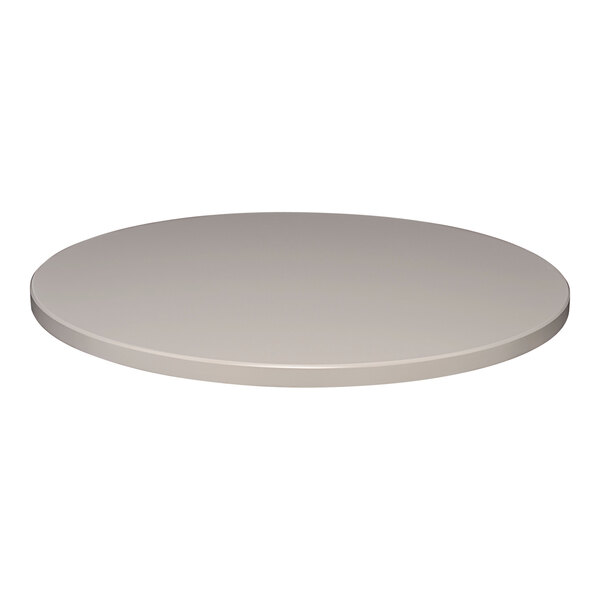 A round stone gray table top for outdoor use.