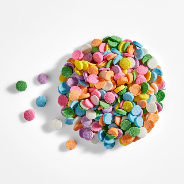 A pile of colorful pastel confetti sequin sprinkles.