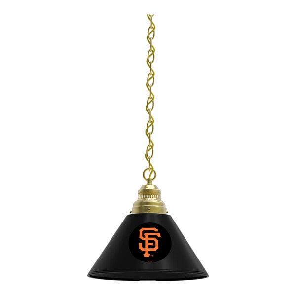 A black lamp with a brass chain and a San Francisco Giants logo on the shade.