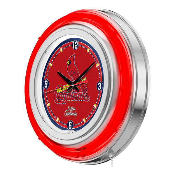 A close-up of a Holland Bar Stool St. Louis Cardinals neon clock with a red and white logo.