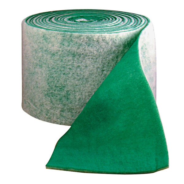 A roll of green and white fabric with green and white paper around it.