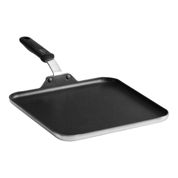 A square, black non-stick griddle pan with a flat cooking surface and a black handle.