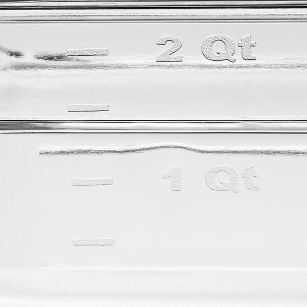 A clear plastic Choice 1/3 Size food pan with measurements on the side.