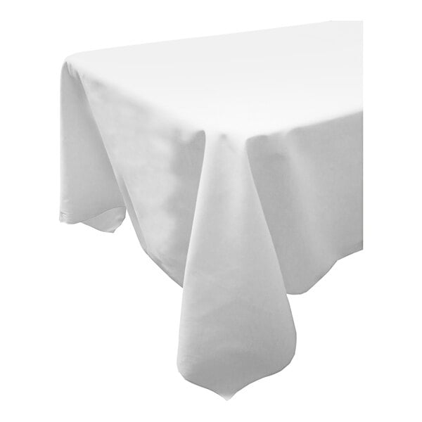 A close-up of a white Snap Drape square table cover on a white table.
