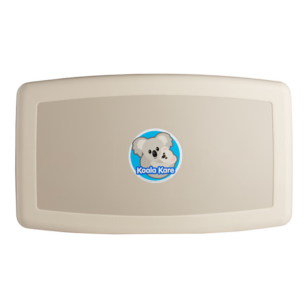 A beige horizontal baby changing station with a koala logo.