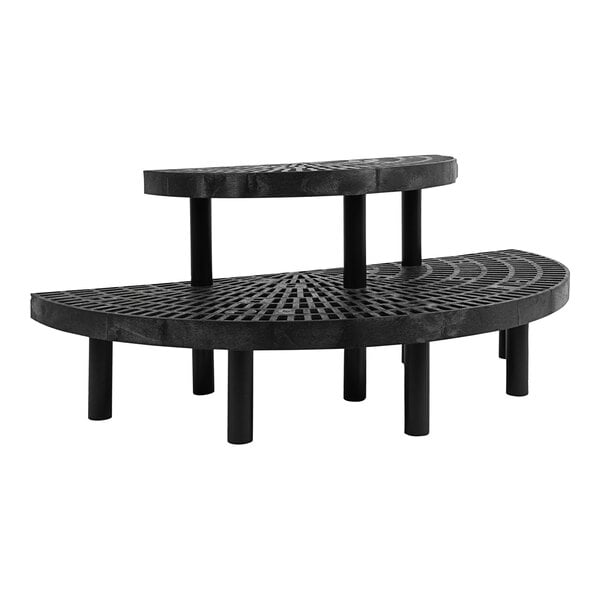 A black plastic grid half round shelf with black legs.