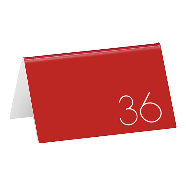 A red rectangular Cal-Mil table tent with the white number 36.