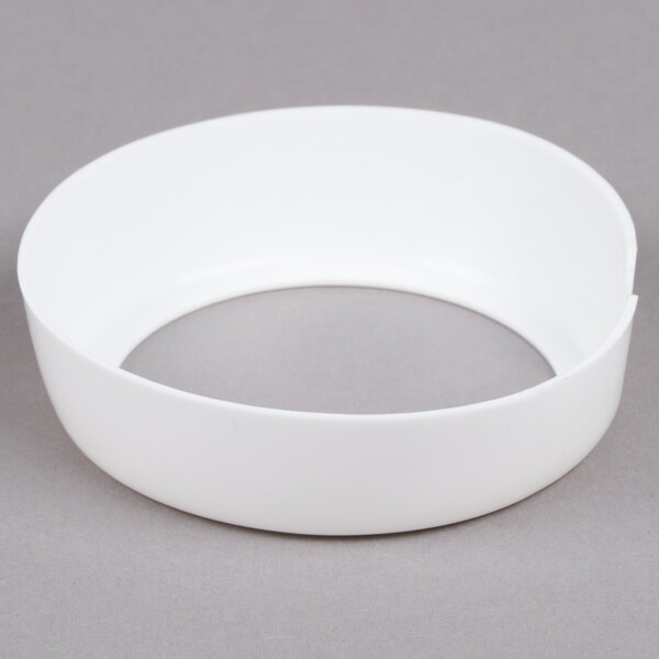 A white circular Tablecraft plastic dispenser collar with a hole in the middle.