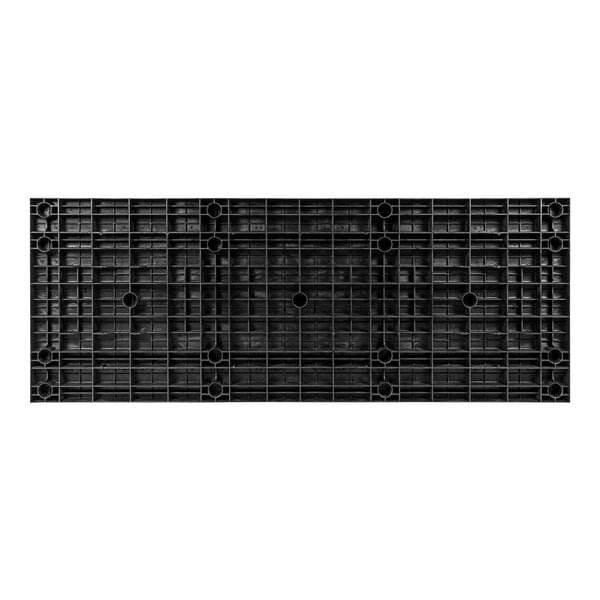 A black plastic surface with holes.