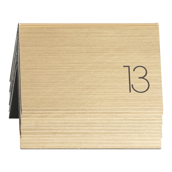 A gold table tent with the number 33.