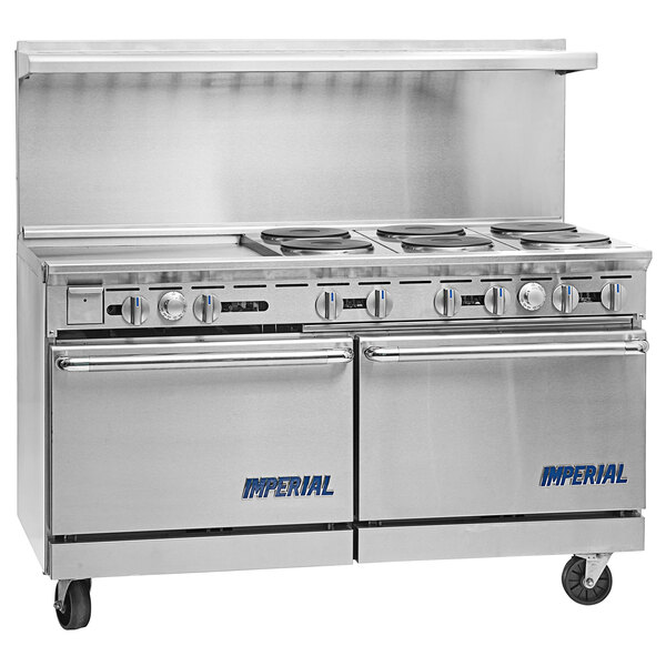 An Imperial Range stainless steel electric range with two ovens on a counter in a professional kitchen.