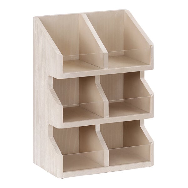 A white-washed pine wood Cal-Mil condiment organizer with three shelves.