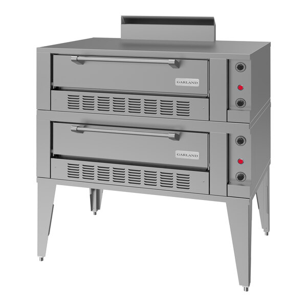 A large stainless steel double deck gas pizza oven with front control knobs and ventilation panels.