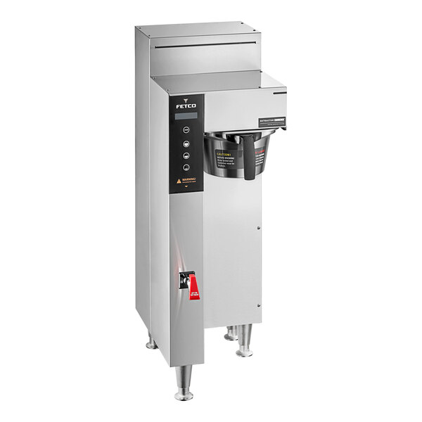 A large stainless steel Fetco CBS-1251 coffee machine with a metal brew basket and buttons.