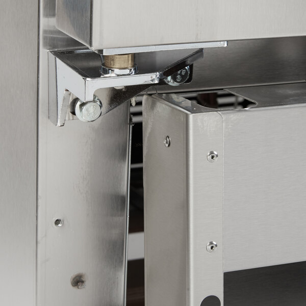 A close-up of a stainless steel bottom left hinge pivot for a Main Street Equipment BMR-49-R or BMR-49-F.