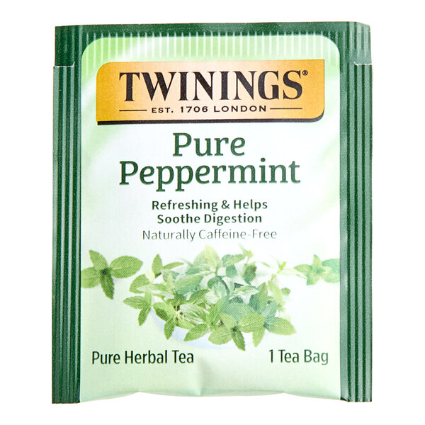 A green and white package of Twinings Pure Peppermint Herbal Tea Bags.