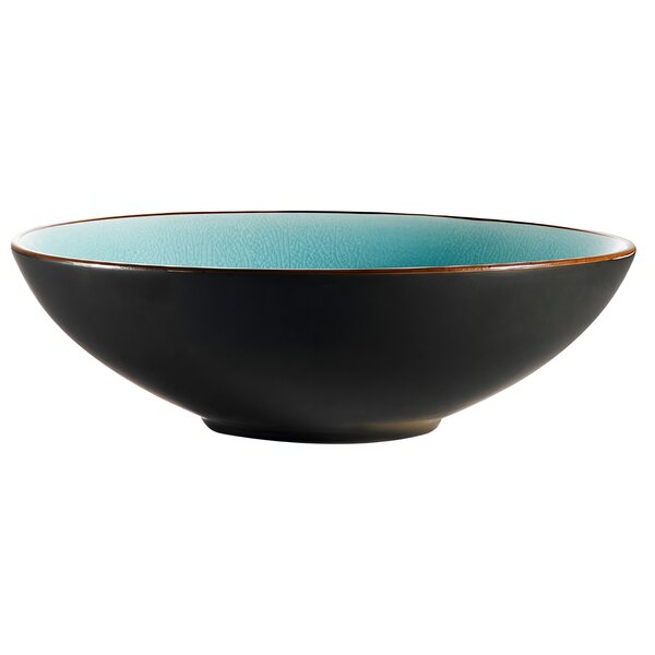 A black stoneware bowl with a blue and brown rim.