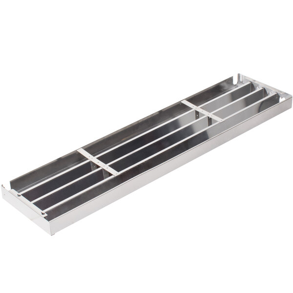 A long rectangular stainless steel grille with holes.