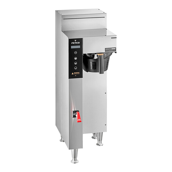 A silver coffee machine with a black handle.