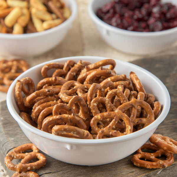 A white Carlisle Dallas Ware nappie bowl filled with pretzels.