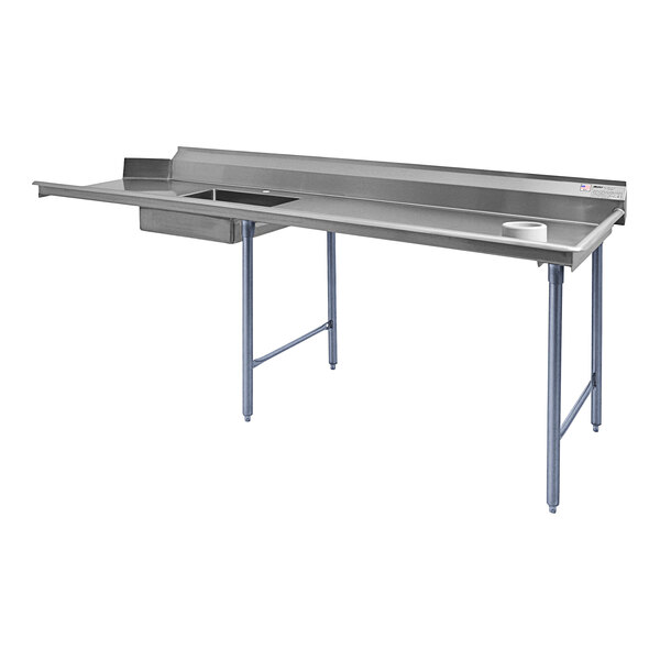 A stainless steel work table with a sink on the right.