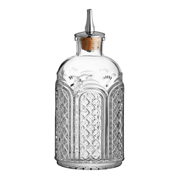 A clear glass Barfly Bitters Bottle with a cork lid.