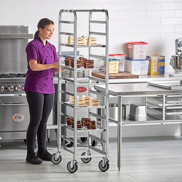 A woman standing next to a metal rack for platters.