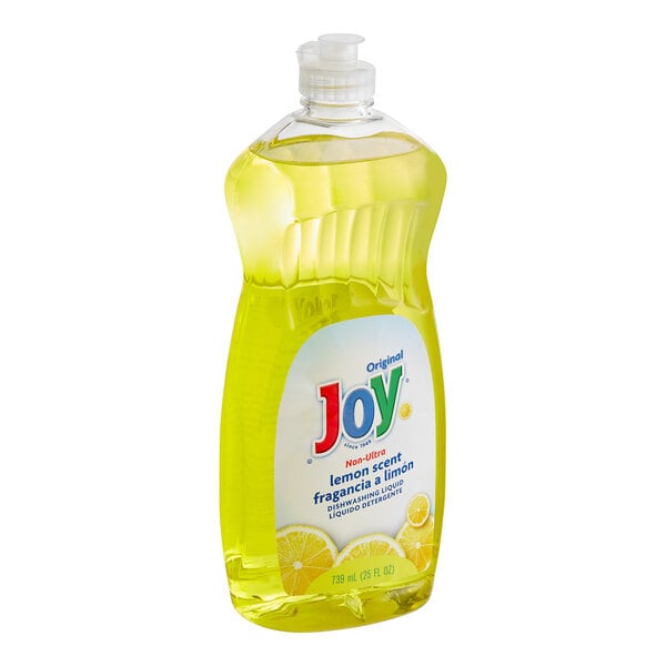 A bottle of Joy lemon scented dishwashing liquid on a counter.