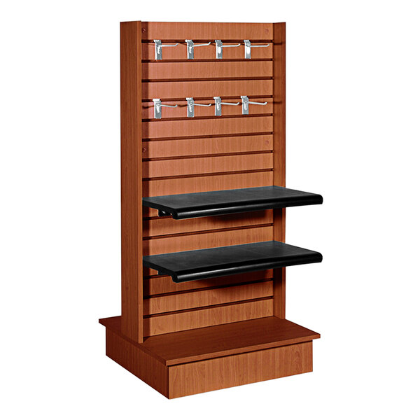 A cherry wood double-sided slatwall display with wood shelves and hooks.