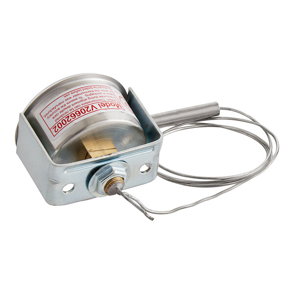 A Miljoco 2" Flush Mount Vapor Dial Thermometer with a U-Clamp. A metal device with a wire.