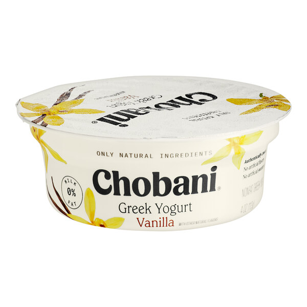 A white Chobani Greek yogurt container with black text and yellow flowers on the lid.