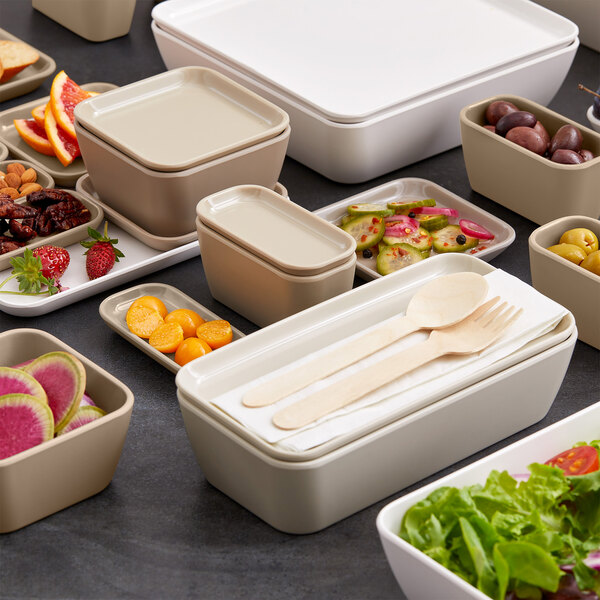 An American Metalcraft white melamine square bowl filled with a variety of food.