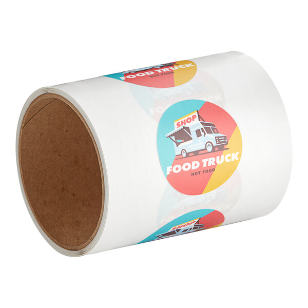 A roll of customizable round vinyl stickers with blue and red text that says "Food Truck" on a white background.