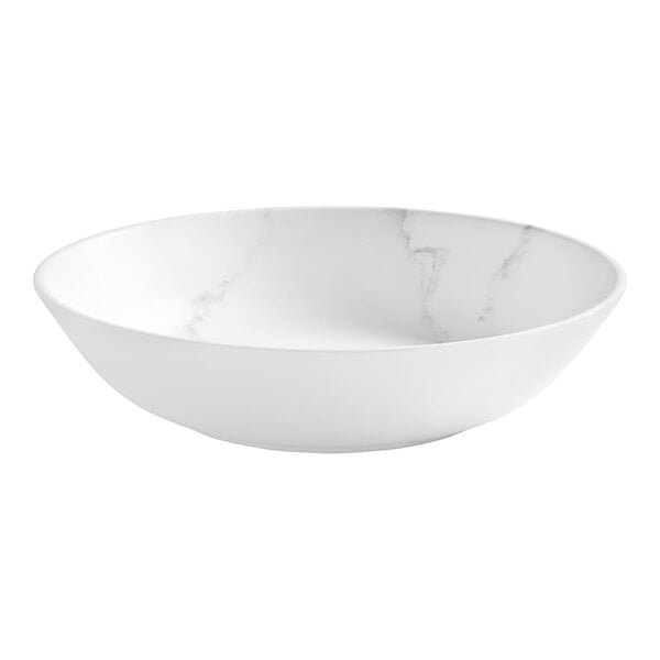 A white melamine bowl with marble pattern on the inside and white rim.