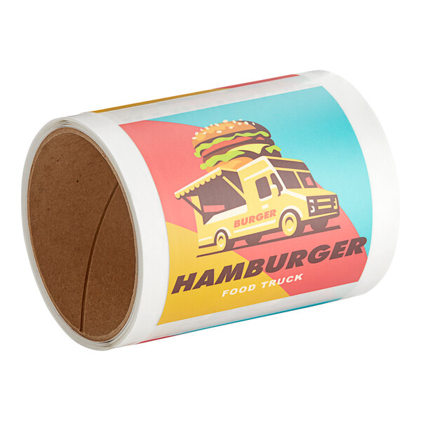 A roll of white square vinyl stickers with a yellow food truck on them.