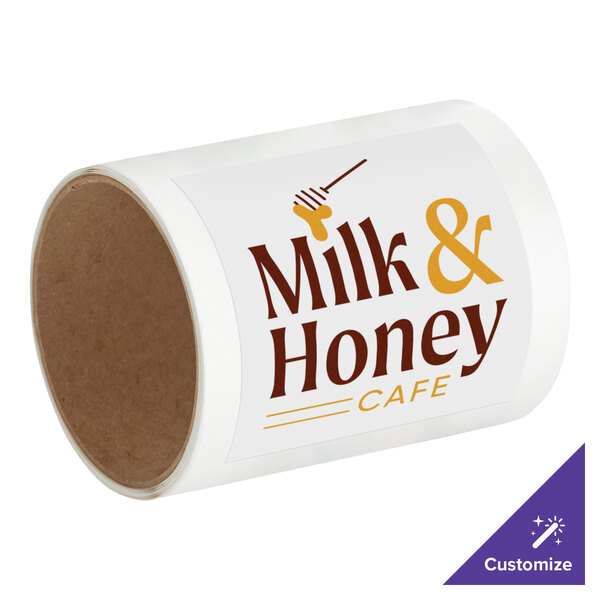 A white roll of vinyl labels with brown text reading "Milk and Honey Cafe"