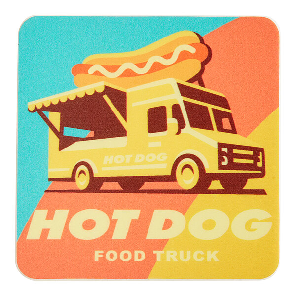 A yellow food truck with a red, blue, and yellow awning serving hot dogs with a Vintage Carnival King coaster.
